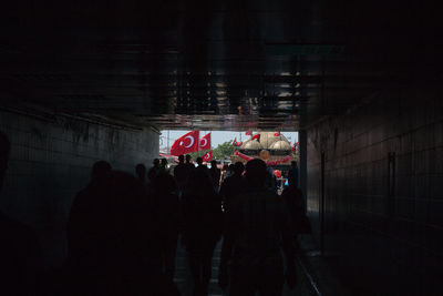 People in illuminated building