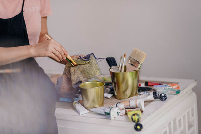 Midsection of woman working on table