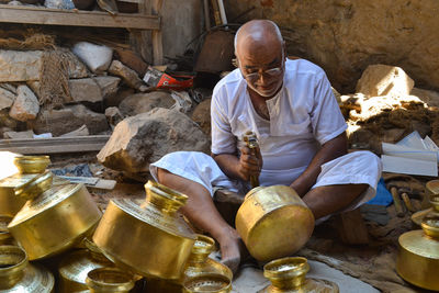Midsection of man preparing food