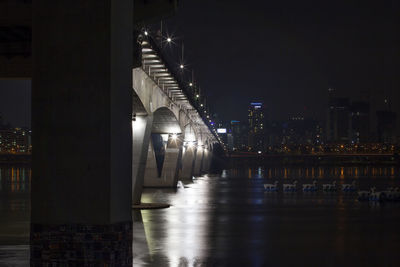 Illuminated bridge over han river at yeouido during night