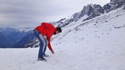 Scenic view of snow covered mountain against sky