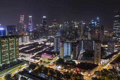 Aerial view of city lit up at night