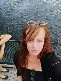 Portrait of mature woman on boat in lake