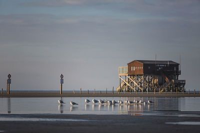 Pier over sea against sky