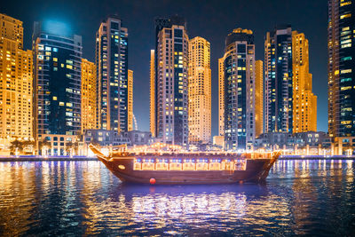 Illuminated buildings in city at night