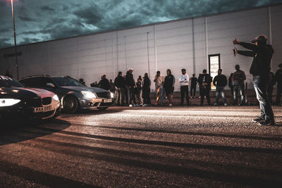 Crowd of people watching street race