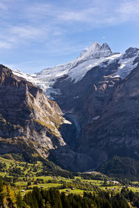 Scenic view of snowcapped mountains against sky