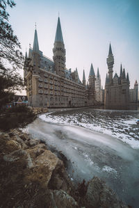 View of buildings against sky during winter