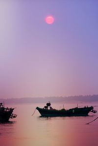 Scenic view of sea against clear sky at night