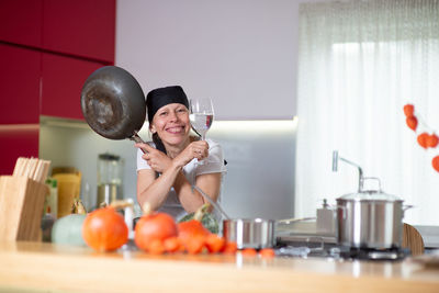 Young woman smiling at home