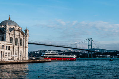 View of bridge over river in city