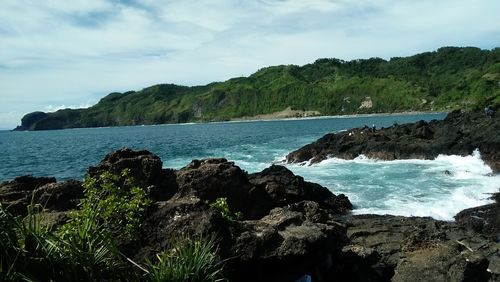 Scenic view of bay against sky