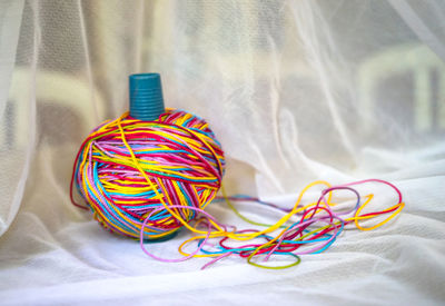 Close-up of colorful wool on fabric