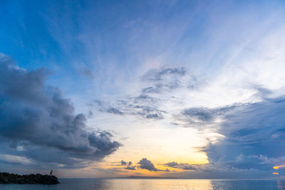 Low angle view of sea against sky during sunset