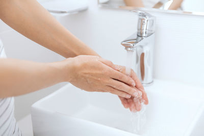 Midsection of woman in bathtub