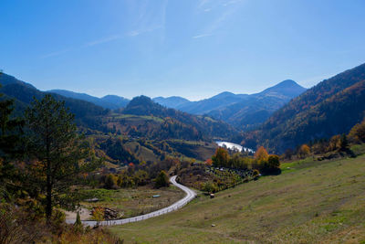 Scenic view of landscape and mountains against sky