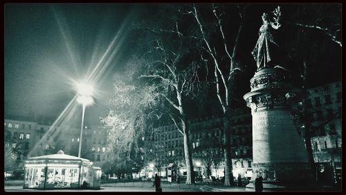 View of illuminated street lights at night