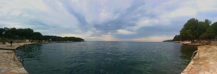 water, sky, sea, tranquil scene, scenics, tranquility, beauty in nature, cloud - sky, tree, nature, cloud, horizon over water, rippled, idyllic, cloudy, waterfront, panoramic, outdoors, no people, day