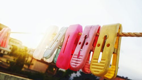 Low angle view of colored pencils against sky