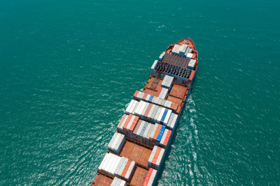 High angle view of container ship on sea