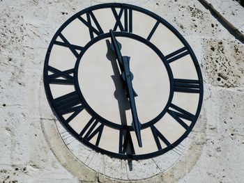 Close-up of clock on wall