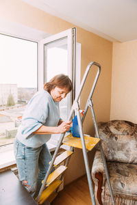 Rear view of man working at home