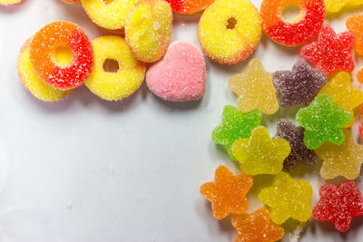 High angle view of multi colored candies on table