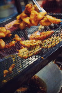 Close-up of meat on barbecue grill