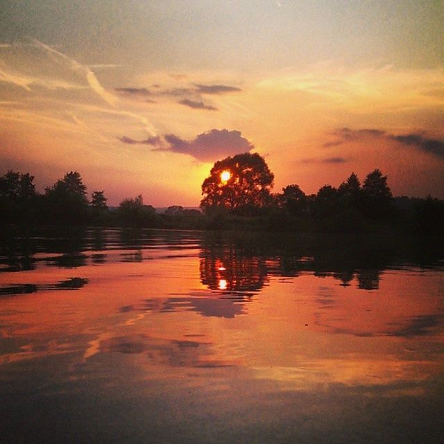 sunset, water, silhouette, orange color, sky, reflection, tranquil scene, scenics, tranquility, beauty in nature, idyllic, cloud - sky, lake, nature, tree, sun, waterfront, cloud, outdoors, dramatic sky