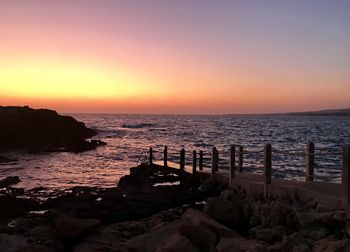 Scenic view of sea against sky during sunset