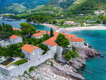 High angle view of townscape by sea