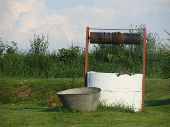 Built structure on field against sky