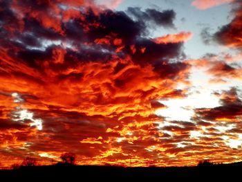 Low angle view of dramatic sky during sunset