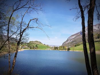 Scenic view of lake against blue sky