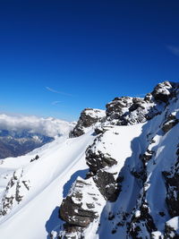 Scenic view of snow covered mountains