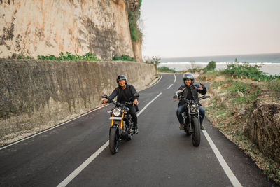 Man riding motorcycle on road