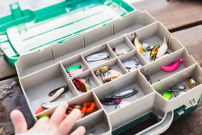 High angle view of hands on table