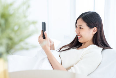 Young woman using mobile phone