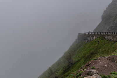 Cycling in foggy mountain side