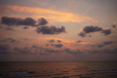 Scenic view of sea against sunset sky