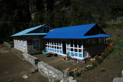 Built structure on field by house at the himalayan mountains