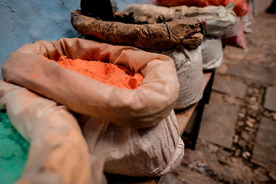 Midsection of man preparing food on table at market