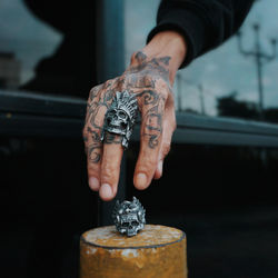 Close-up of man holding cigarette