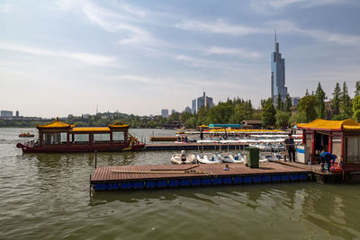 View of boats in river against buildings