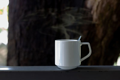 Close-up of coffee cup on table