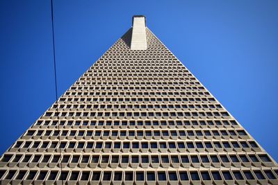 Low angle view of skyscraper against clear sky