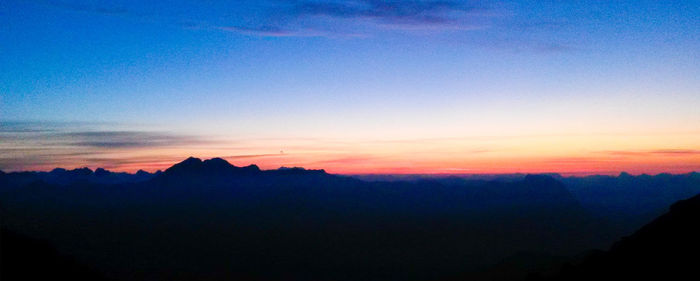 Silhouette of trees against sky at sunset