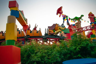 Panoramic view of amusement park against clear sky