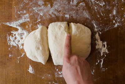 Close-up of person preparing food on cutting board