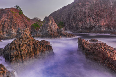 Panoramic view of rock formations against sky